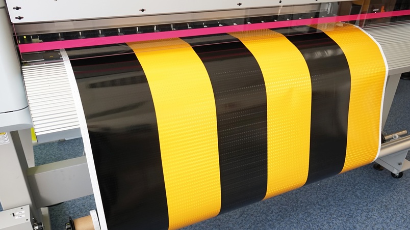 Large foil is printed with a foil printer black yellow striped